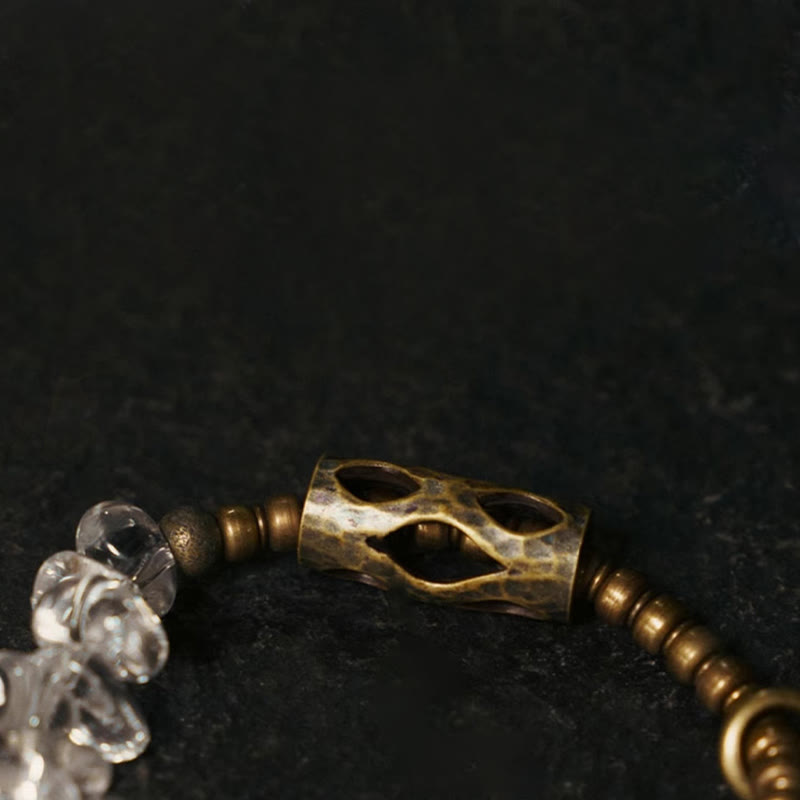 Bracciale Buddha Stones con cristalli bianchi irregolari e purezza del rame