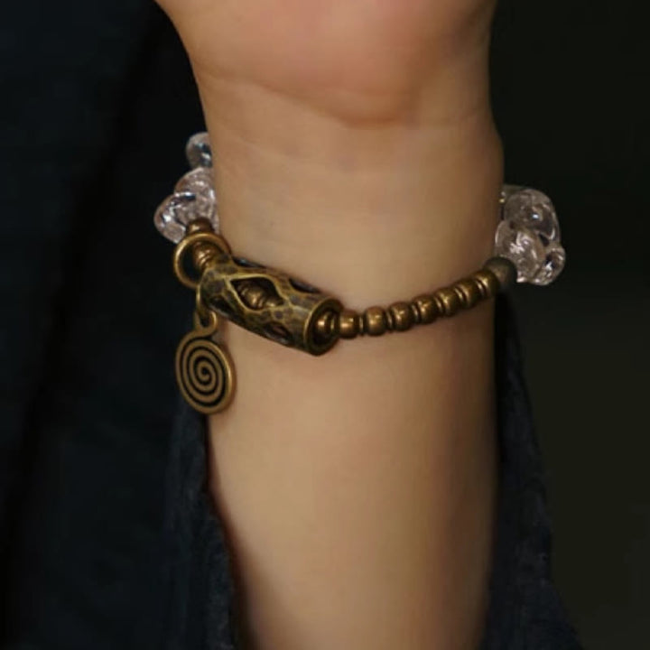 Bracciale Buddha Stones con cristalli bianchi irregolari e purezza del rame