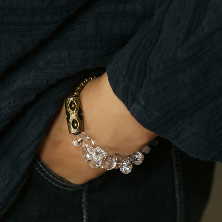 Bracciale Buddha Stones con cristalli bianchi irregolari e purezza del rame