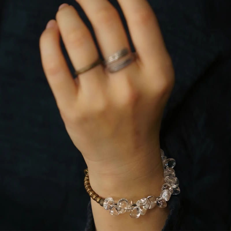 Bracciale Buddha Stones con cristalli bianchi irregolari e purezza del rame
