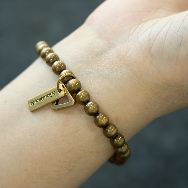 Braccialetto di equilibrio con perline di rame Buddha Stones
