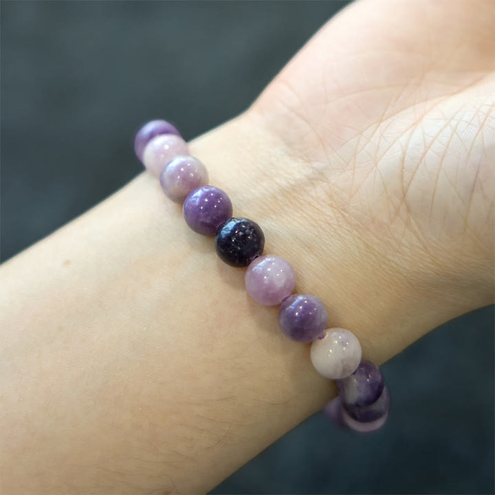 Braccialetto positivo in pietra di mica viola Buddha Stones