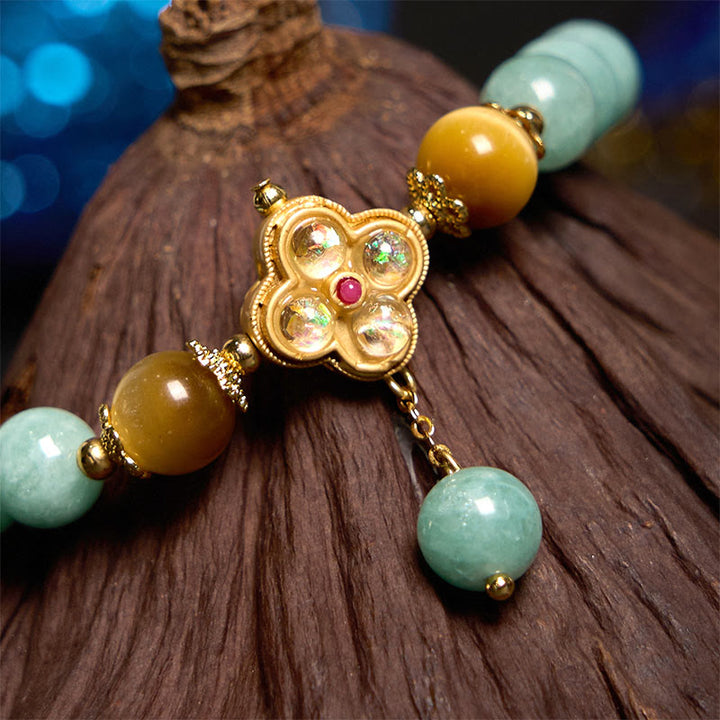 Braccialetto della prosperità con occhio di tigre giallo e giada Buddha Stones