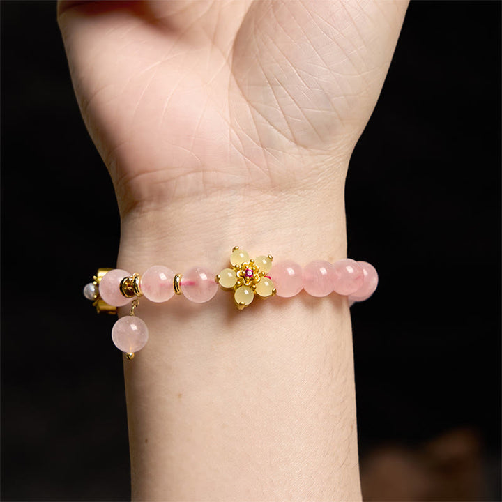 Braccialetto Buddha Stones con fiore di citrino e cristallo rosa