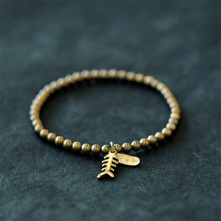 Braccialetto curativo in rame con ossi di pesce Buddha Stones
