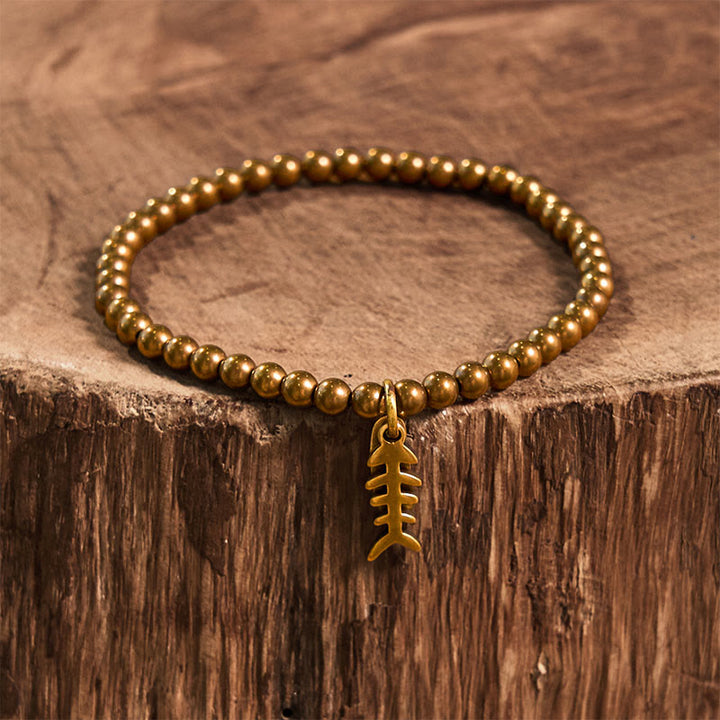 Braccialetto curativo in rame con ossi di pesce Buddha Stones