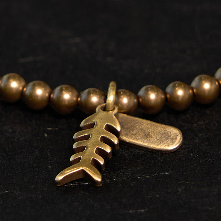 Braccialetto curativo in rame con ossi di pesce Buddha Stones