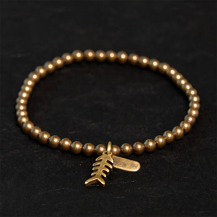 Braccialetto curativo in rame con ossi di pesce Buddha Stones
