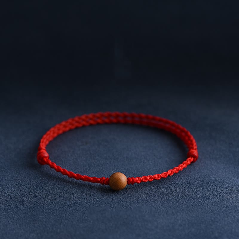 Bracciale intrecciato con perline di legno di pesca naturale Buddha Stones che allontanano gli spiriti maligni - image 0