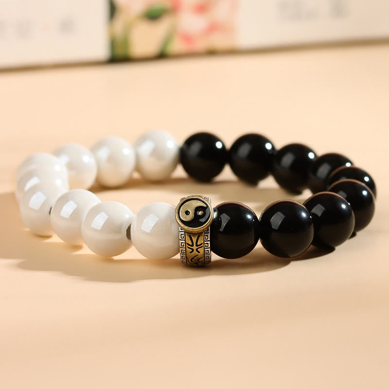 Braccialetto di realizzazione Yin Yang con perline di porcellana bianca e ossidiana nera Buddha Stones