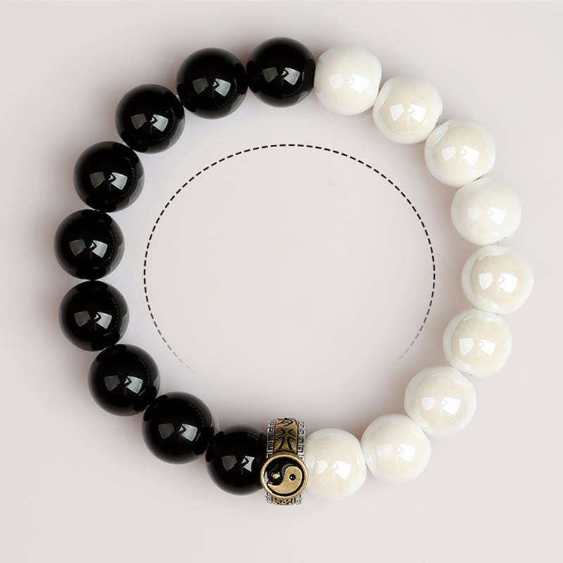 Braccialetto di realizzazione Yin Yang con perline di porcellana bianca e ossidiana nera Buddha Stones
