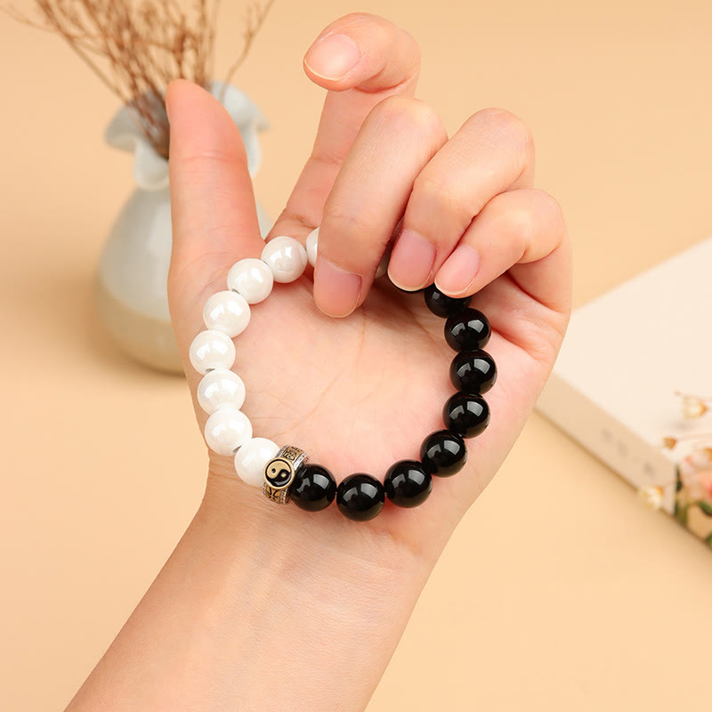 Braccialetto di realizzazione Yin Yang con perline di porcellana bianca e ossidiana nera Buddha Stones