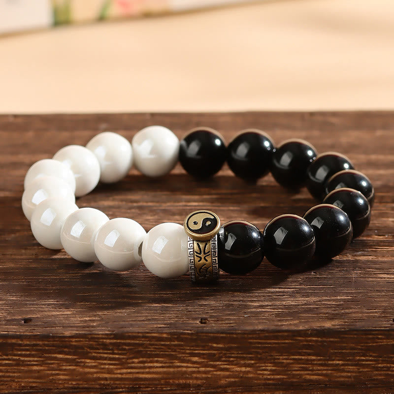 Braccialetto di realizzazione Yin Yang con perline di porcellana bianca e ossidiana nera Buddha Stones