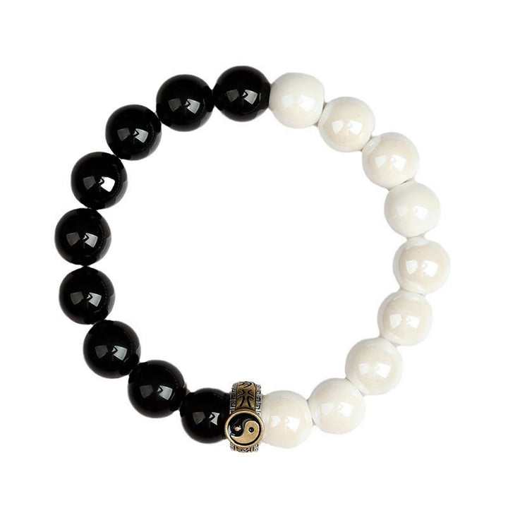 Braccialetto di realizzazione Yin Yang con perline di porcellana bianca e ossidiana nera Buddha Stones