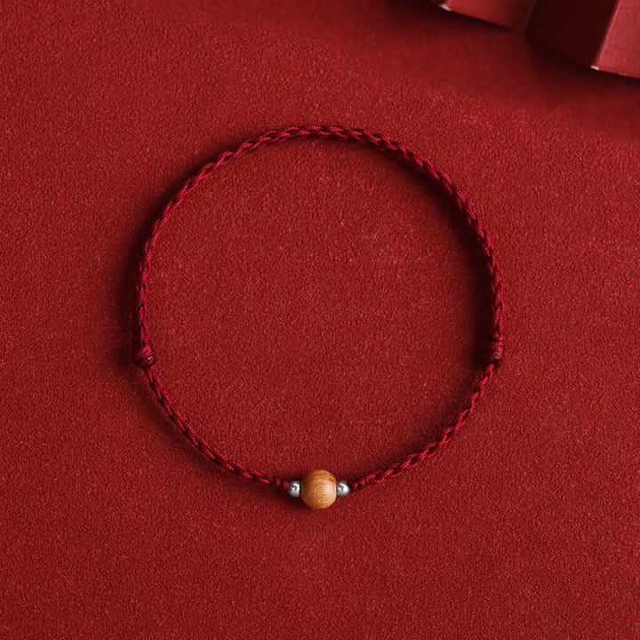 Braccialetto alla caviglia intrecciato con perline di legno di pesca naturale Buddha Stones