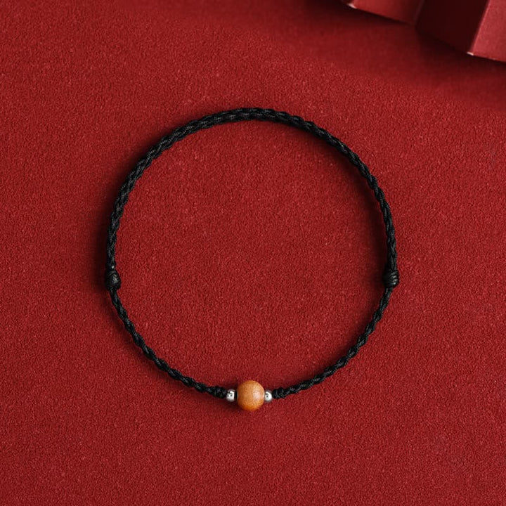 Braccialetto alla caviglia intrecciato con perline di legno di pesca naturale Buddha Stones