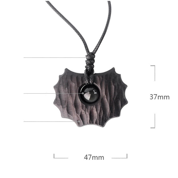 Collana pendente Buddha Stones in legno di ebano e ossidiana di forma irregolare, pace e calma