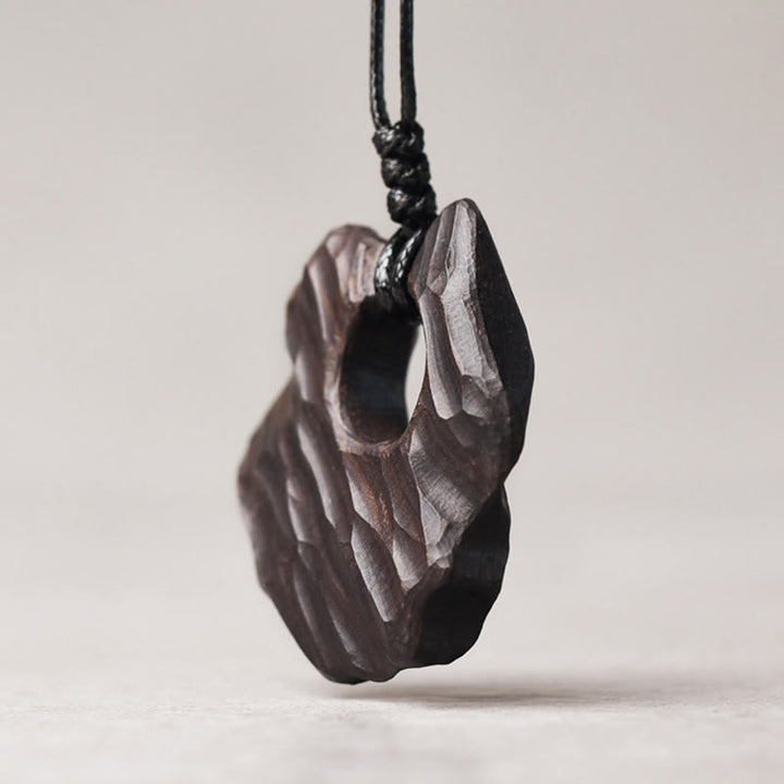 Collana pendente con ciondolo in legno di ebano e forma irregolare cava in Buddha Stones , equilibrio della pace
