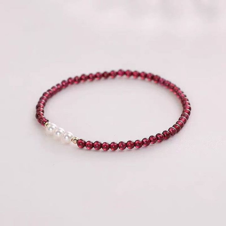 Braccialetto di protezione con piccole perle di granato naturale Buddha Stones