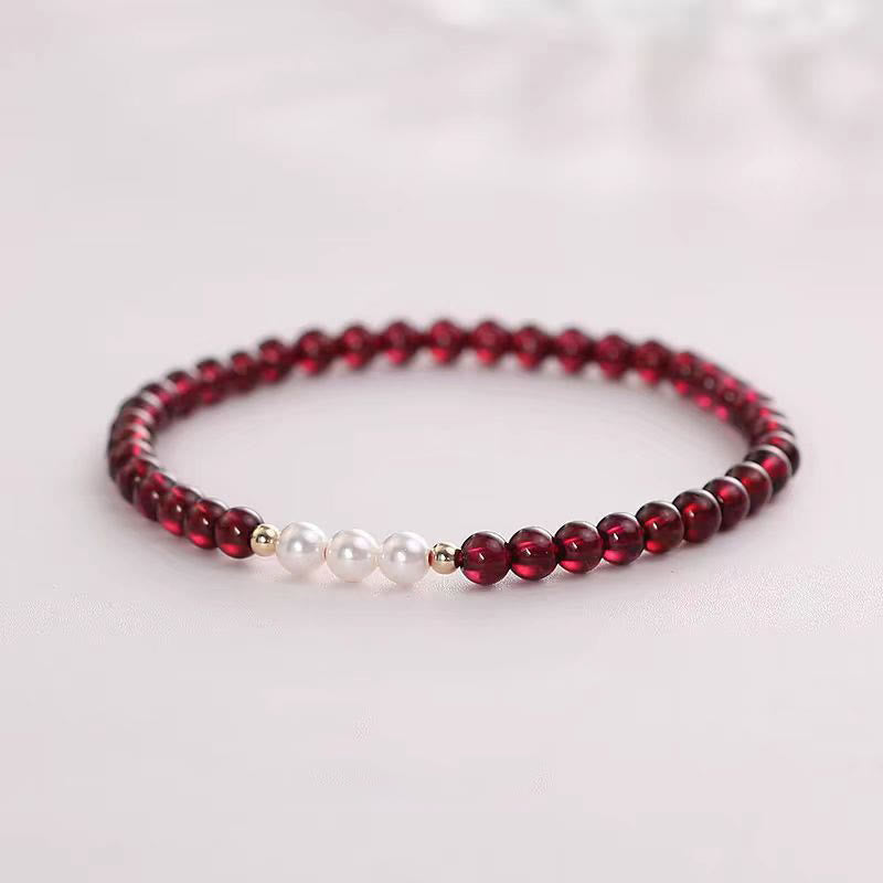 Braccialetto di protezione con piccole perle di granato naturale Buddha Stones