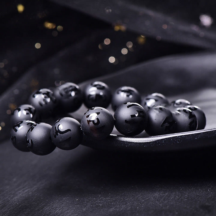 Braccialetto di protezione intagliato in onice nero naturale Om Mani Padme Hum Buddha Stones