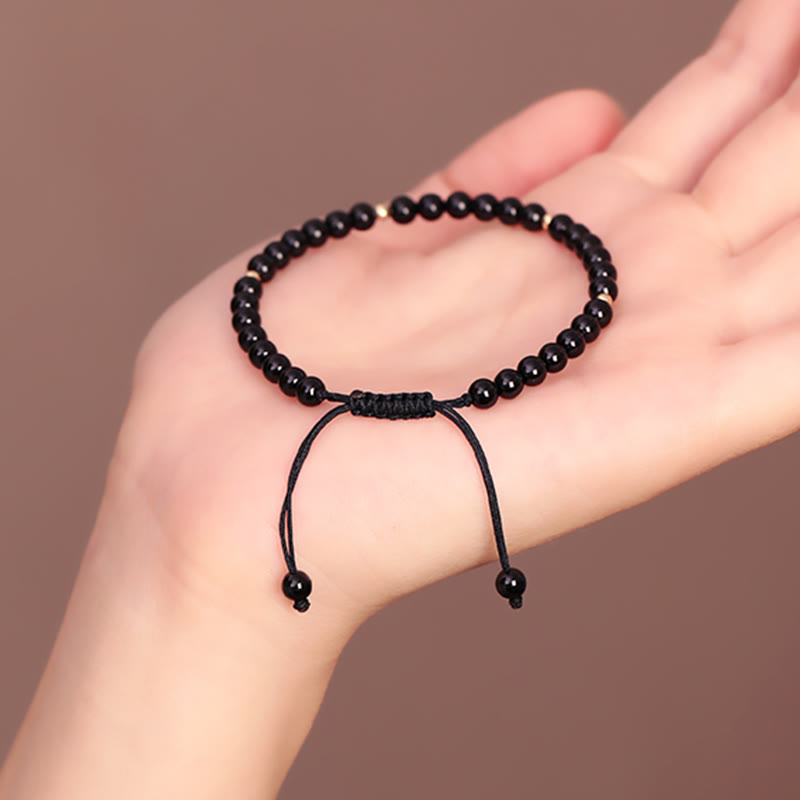 Braccialetto di corda di realizzazione con piccole perle di ossidiana nera Buddha Stones