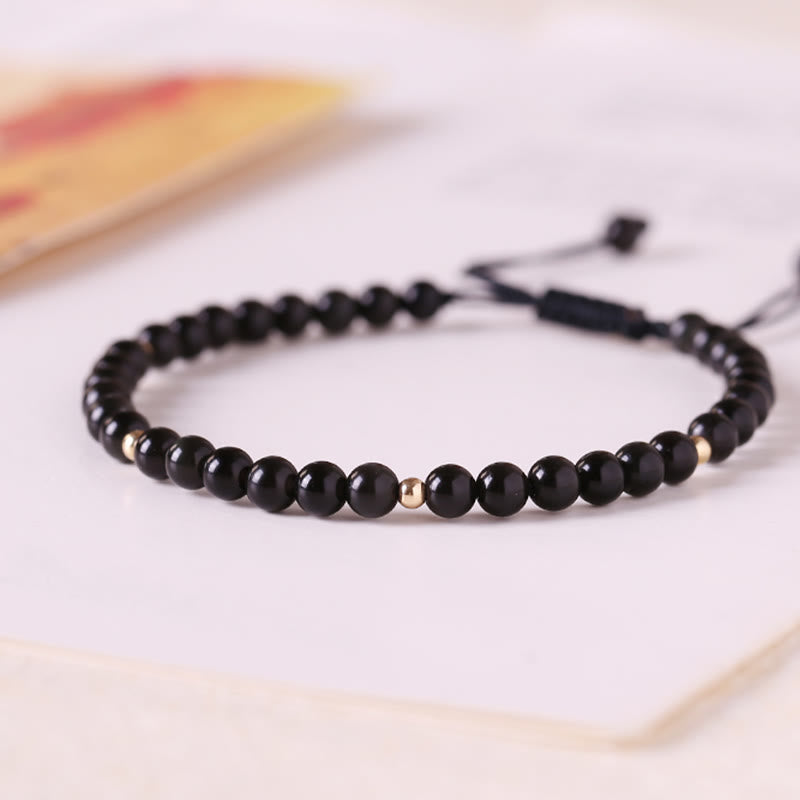 Braccialetto di corda di realizzazione con piccole perle di ossidiana nera Buddha Stones