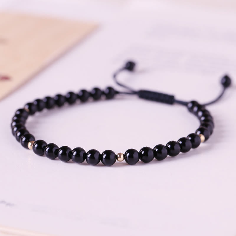 Braccialetto di corda di realizzazione con piccole perle di ossidiana nera Buddha Stones