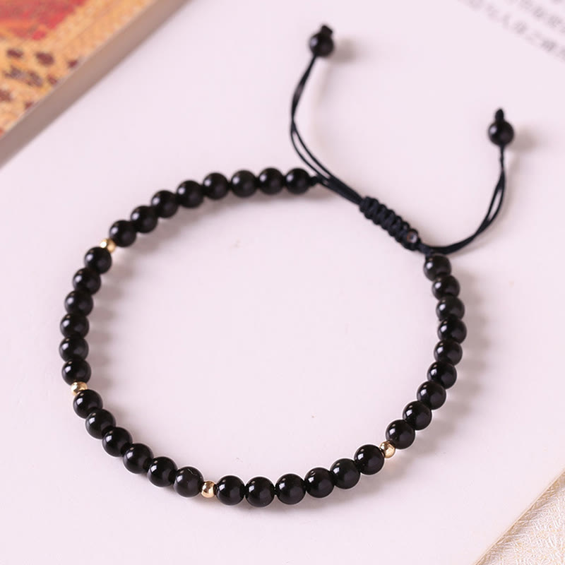 Braccialetto di corda di realizzazione con piccole perle di ossidiana nera Buddha Stones