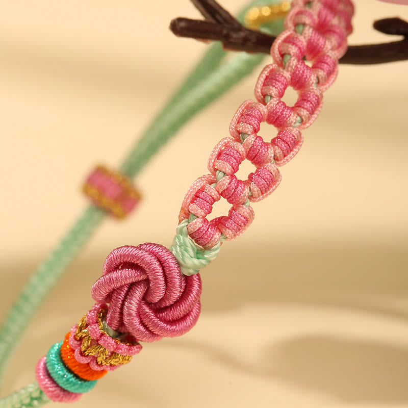 Bracciale intrecciato con nodo in fiore di pesco rosa e verde fatto a mano Buddha Stones