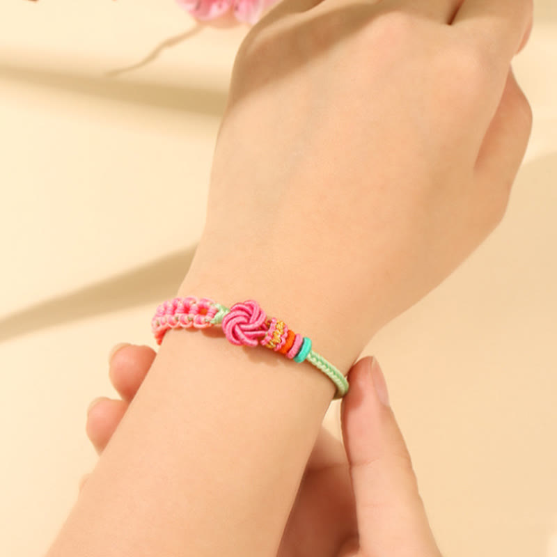 Bracciale intrecciato con nodo in fiore di pesco rosa e verde fatto a mano Buddha Stones