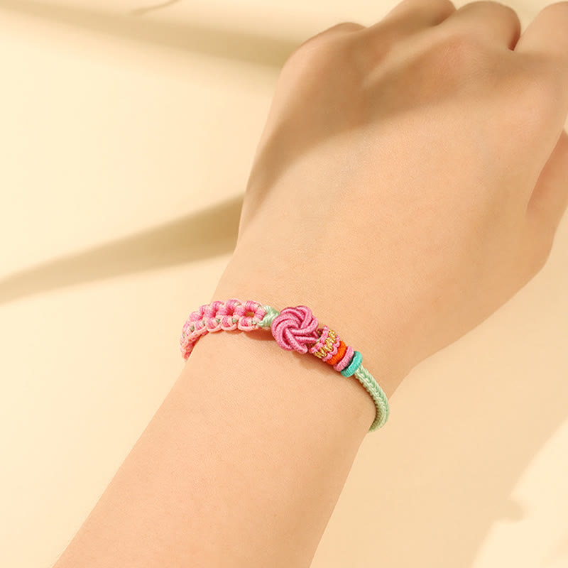 Bracciale intrecciato con nodo in fiore di pesco rosa e verde fatto a mano Buddha Stones