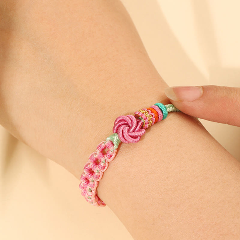 Bracciale intrecciato con nodo in fiore di pesco rosa e verde fatto a mano Buddha Stones
