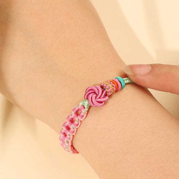 Bracciale intrecciato con nodo in fiore di pesco rosa e verde fatto a mano Buddha Stones
