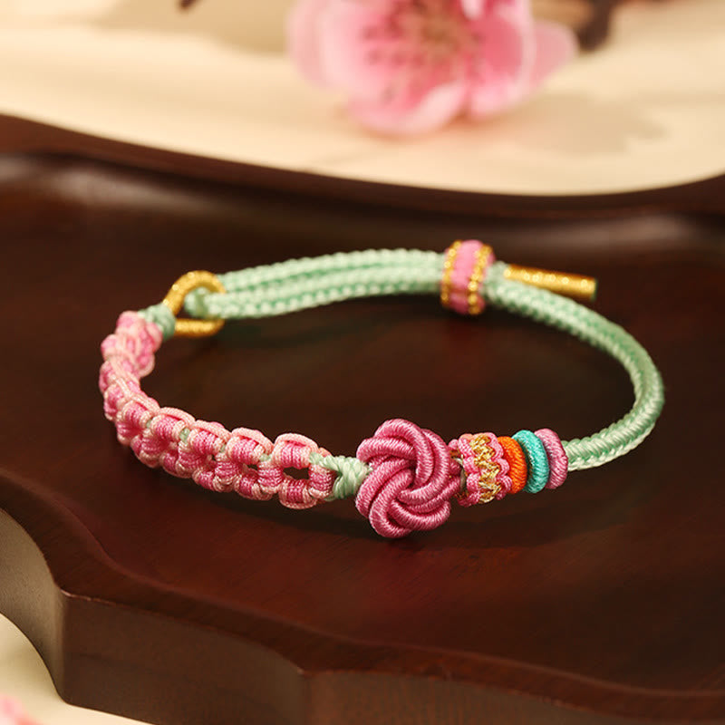 Bracciale intrecciato con nodo in fiore di pesco rosa e verde fatto a mano Buddha Stones