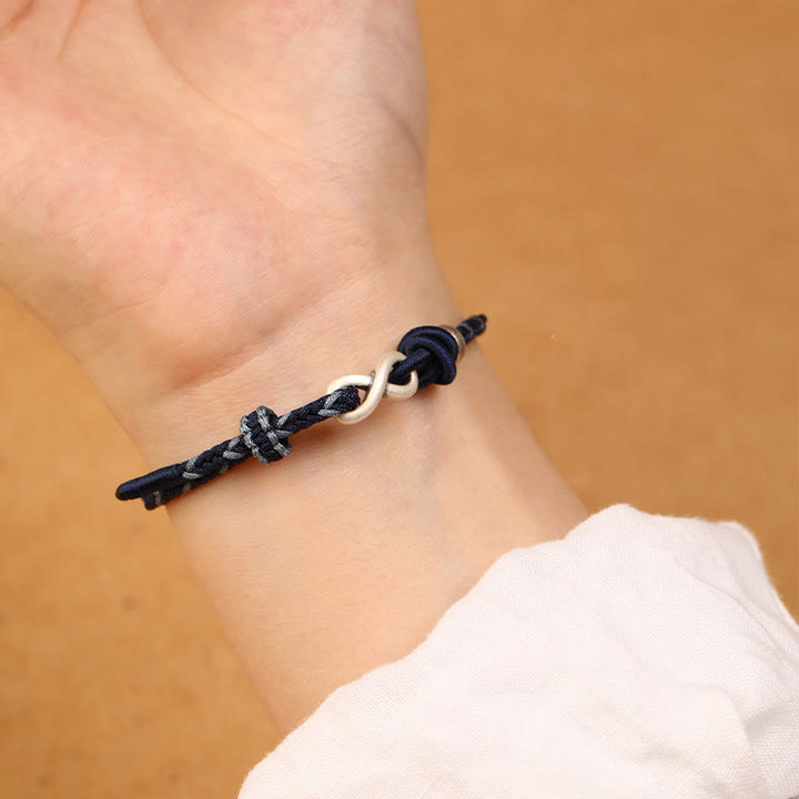 Braccialetto con corda portafortuna con simbolo dell'infinito e nodo infinito in argento sterling 999 fatto a mano Buddha Stones