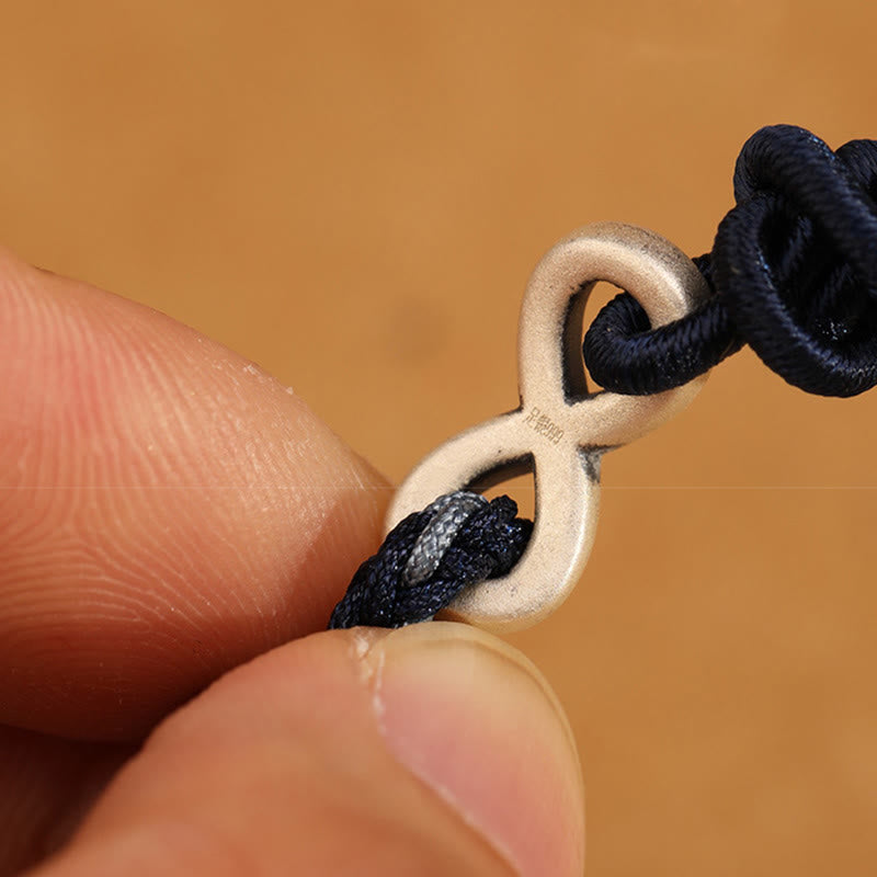 Braccialetto con corda portafortuna con simbolo dell'infinito e nodo infinito in argento sterling 999 fatto a mano Buddha Stones