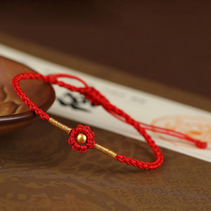 Braccialetto di corda di protezione della fortuna con design a fiori fatto a mano con perline in oro 999 Buddha Stones