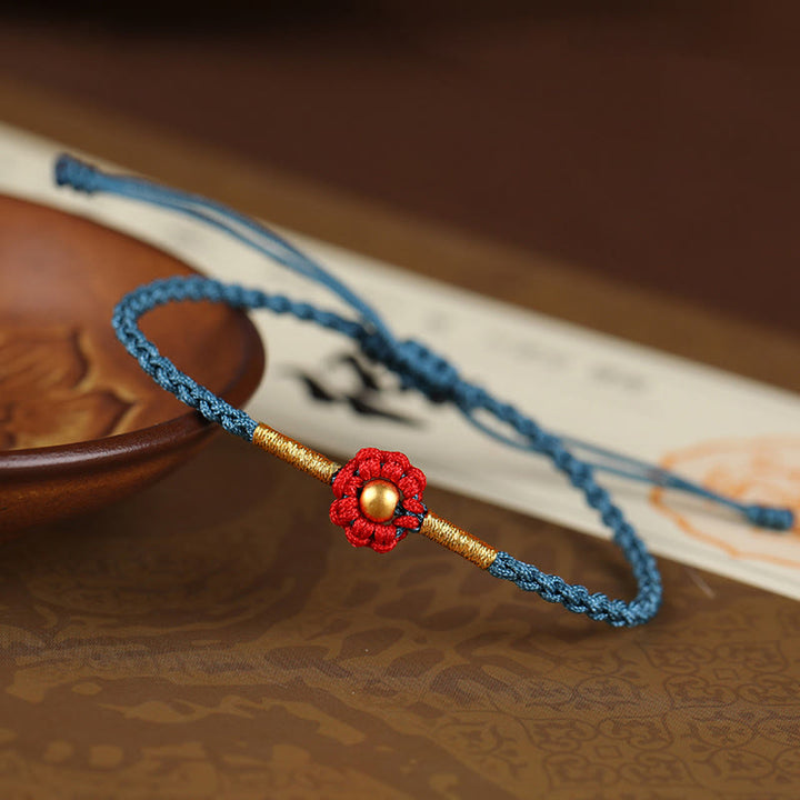 Braccialetto di corda di protezione della fortuna con design a fiori fatto a mano con perline in oro 999 Buddha Stones