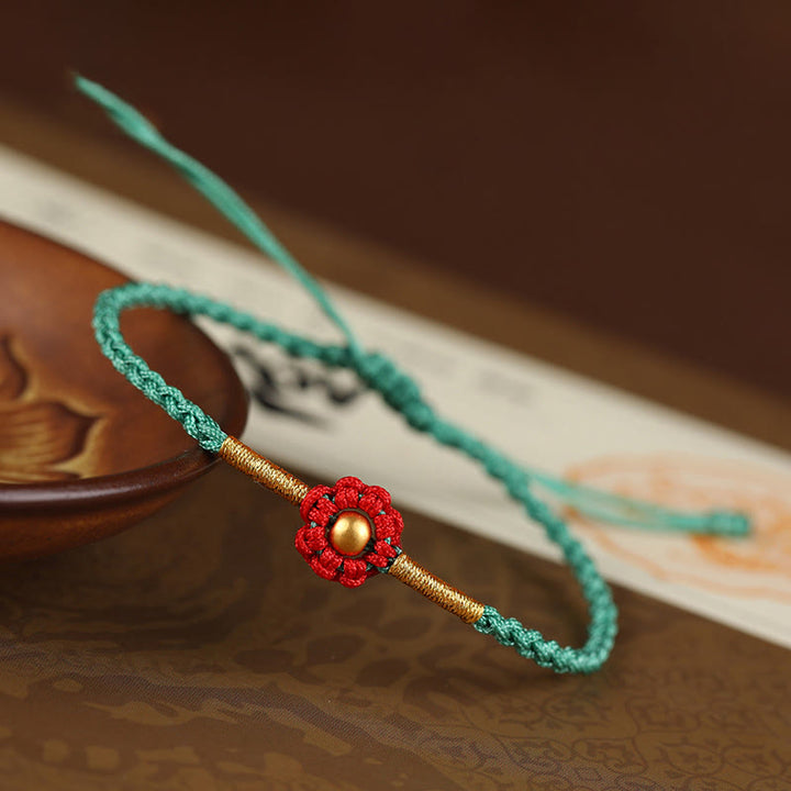 Braccialetto di corda di protezione della fortuna con design a fiori fatto a mano con perline in oro 999 Buddha Stones