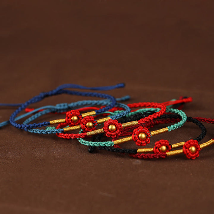 Braccialetto di corda di protezione della fortuna con design a fiori fatto a mano con perline in oro 999 Buddha Stones