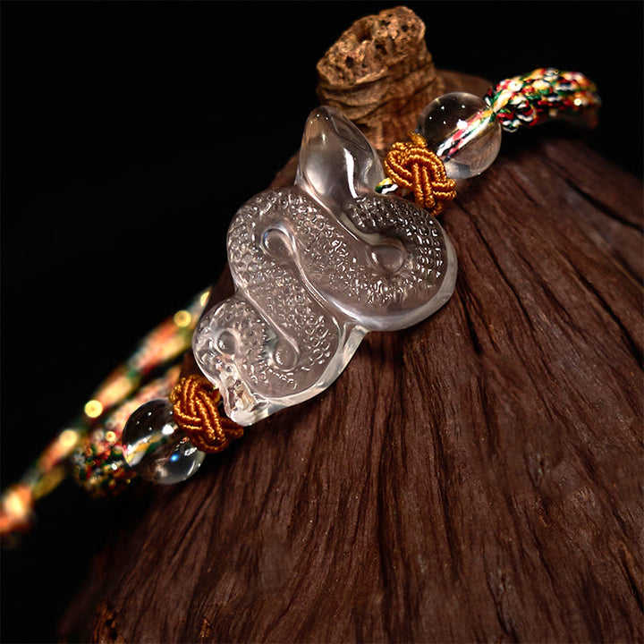 Braccialetto curativo dell'anno del serpente con corda di cristallo bianco Buddha Stones