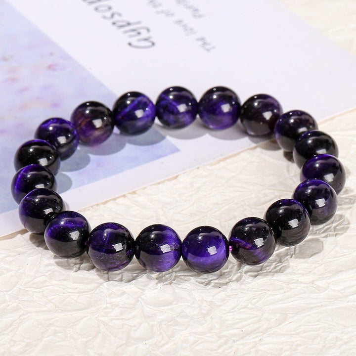Braccialetto della creatività con occhio di tigre viola Buddha Stones