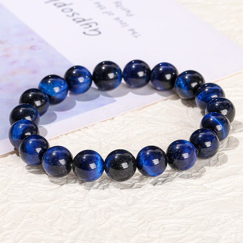 Braccialetto di equilibrio con occhio di tigre blu Buddha Stones