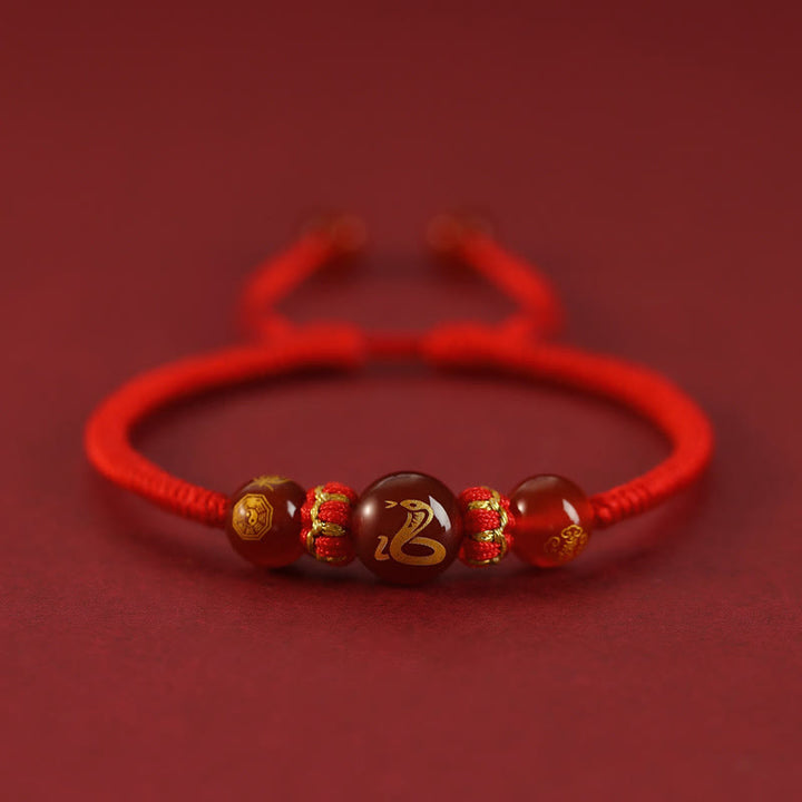 Braccialetto di protezione intrecciato con corda rossa in agata rossa fatto a mano con zodiaco cinese Buddha Stones