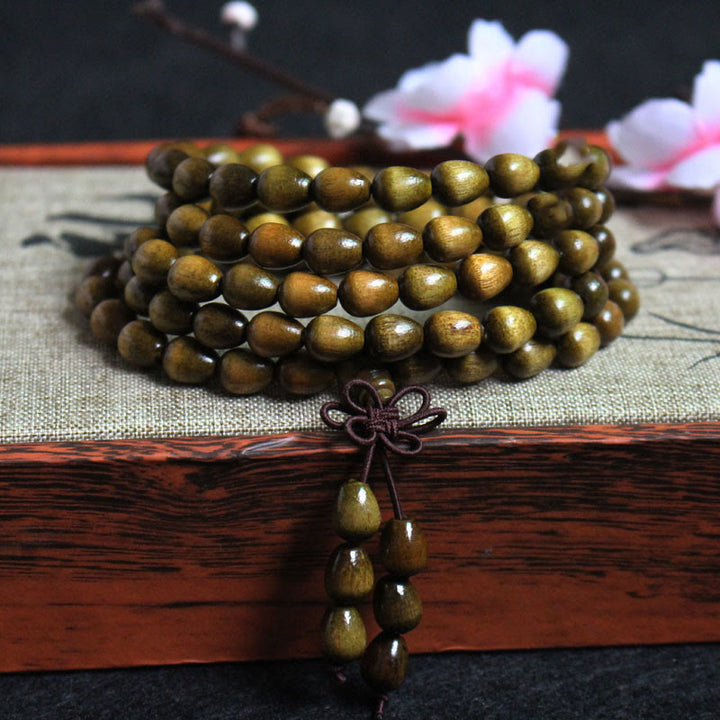 Braccialetto di protezione in legno naturale Phoebe Zhennan con 108 perle a goccia Mala Buddha Stones