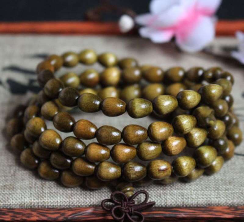Braccialetto di protezione in legno naturale Phoebe Zhennan con 108 perle a goccia Mala Buddha Stones