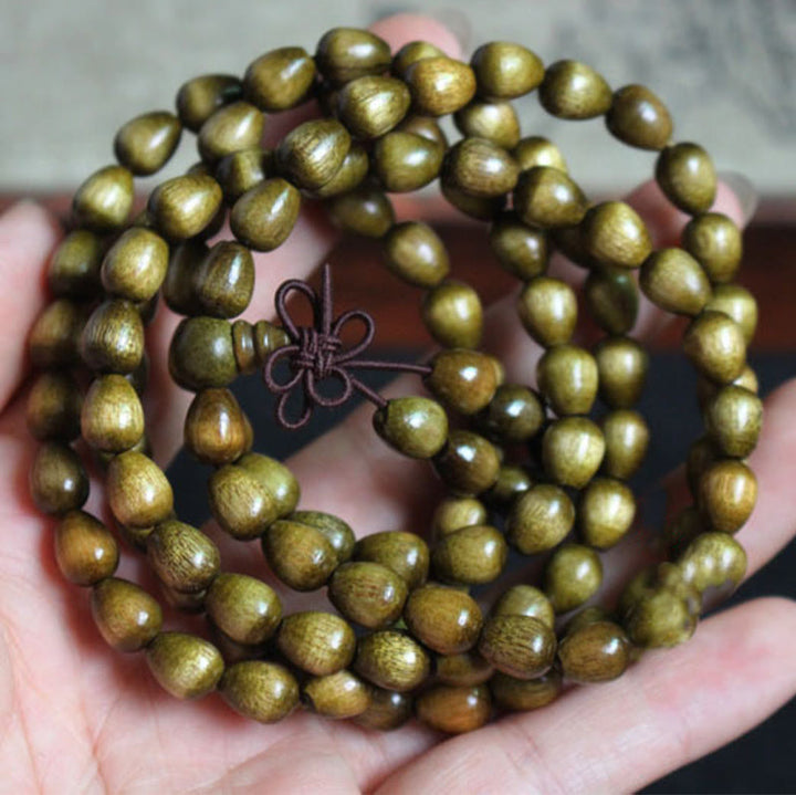 Braccialetto di protezione in legno naturale Phoebe Zhennan con 108 perle a goccia Mala Buddha Stones