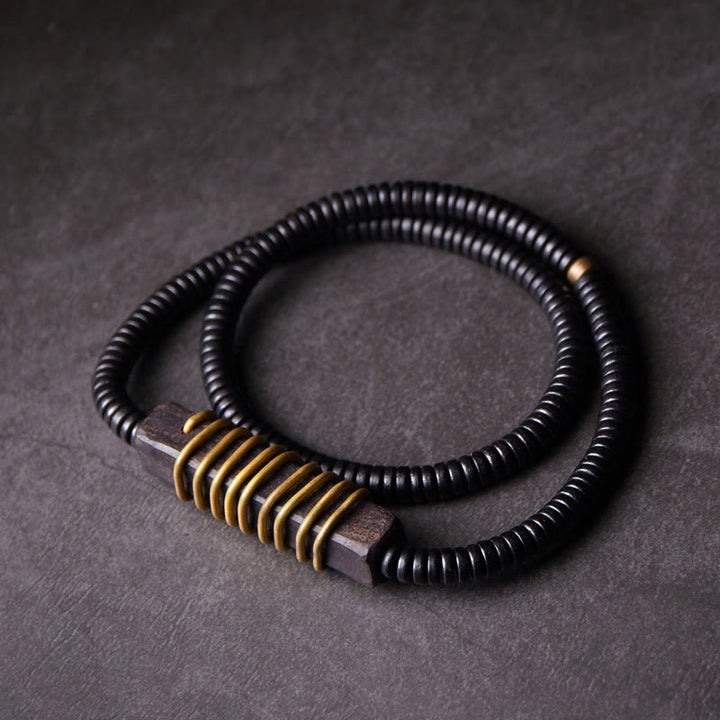 Collana con bracciale a doppio giro in Buddha Stones, in legno di ebano, in ottone e rame, con sfera di equilibrio cubica