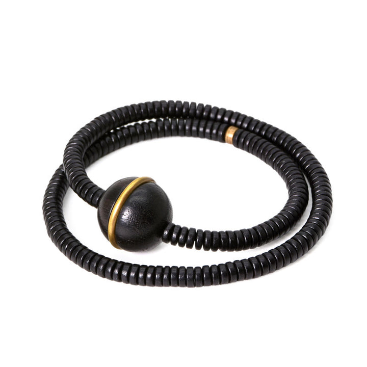 Collana con bracciale a doppio giro in Buddha Stones, in legno di ebano, in ottone e rame, con sfera di equilibrio cubica